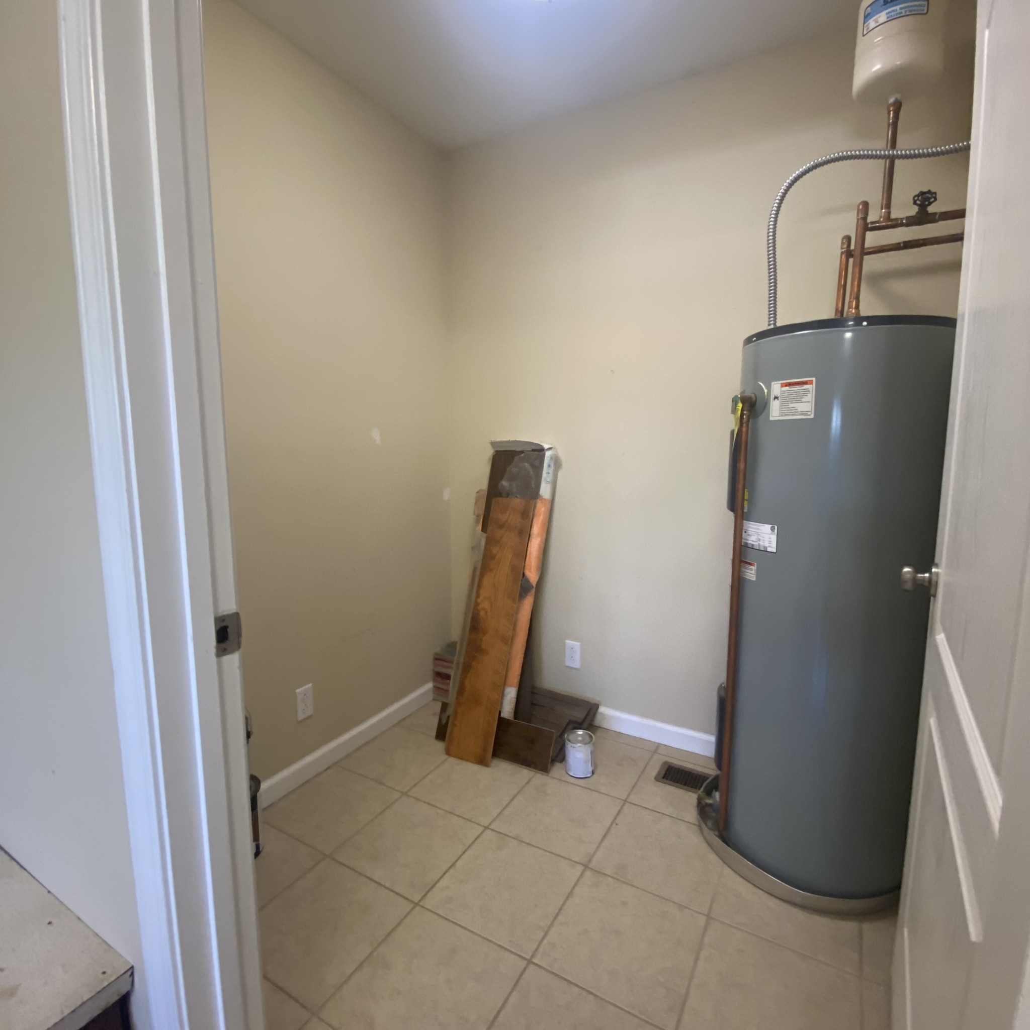 1055 Salem Ridge Road Clarksville, TN 37040 - Photo 17 of 18 a view of a storage and utility room with refrigerator