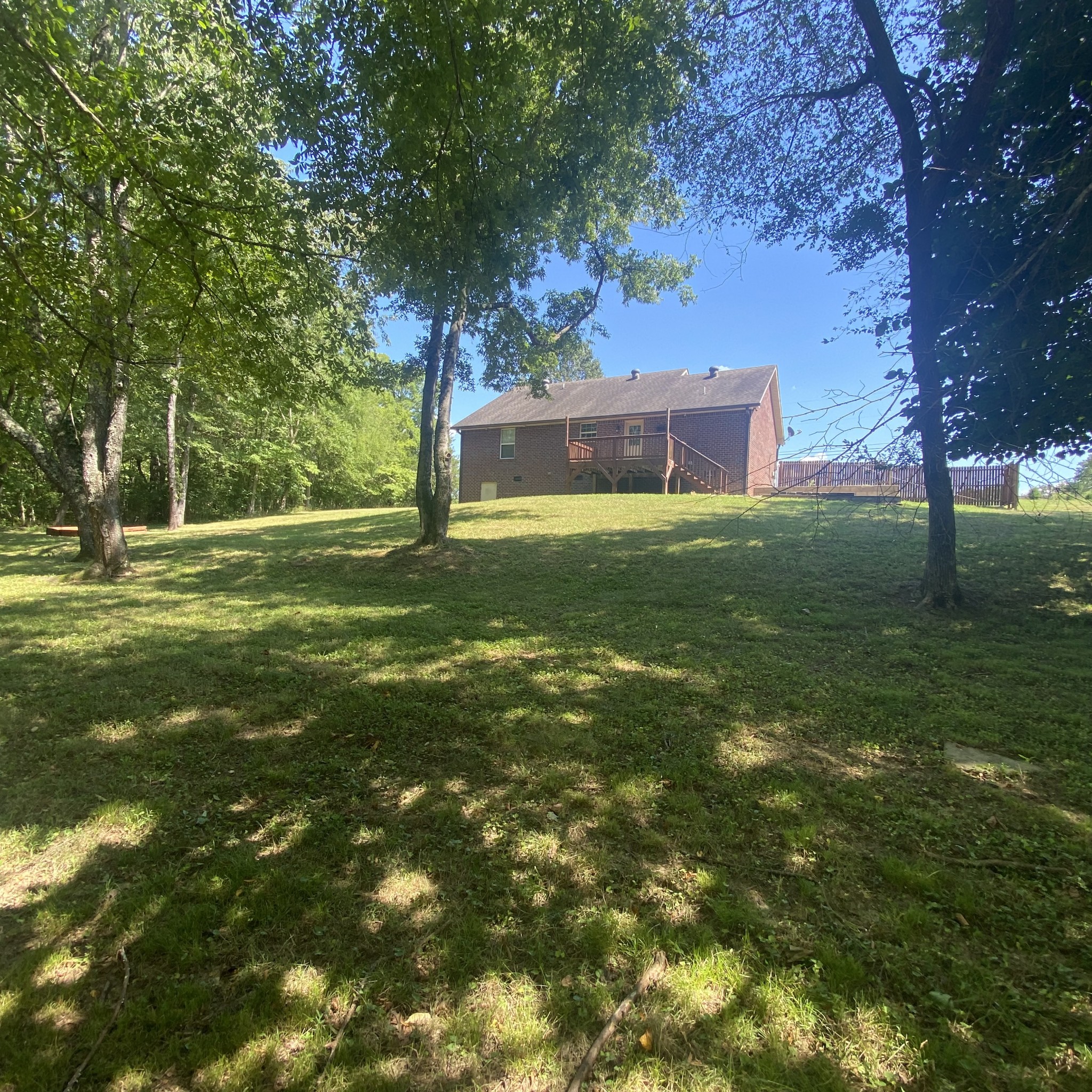 1055 Salem Ridge Road Clarksville, TN 37040 - Photo 4 of 18 a view of a backyard with large trees