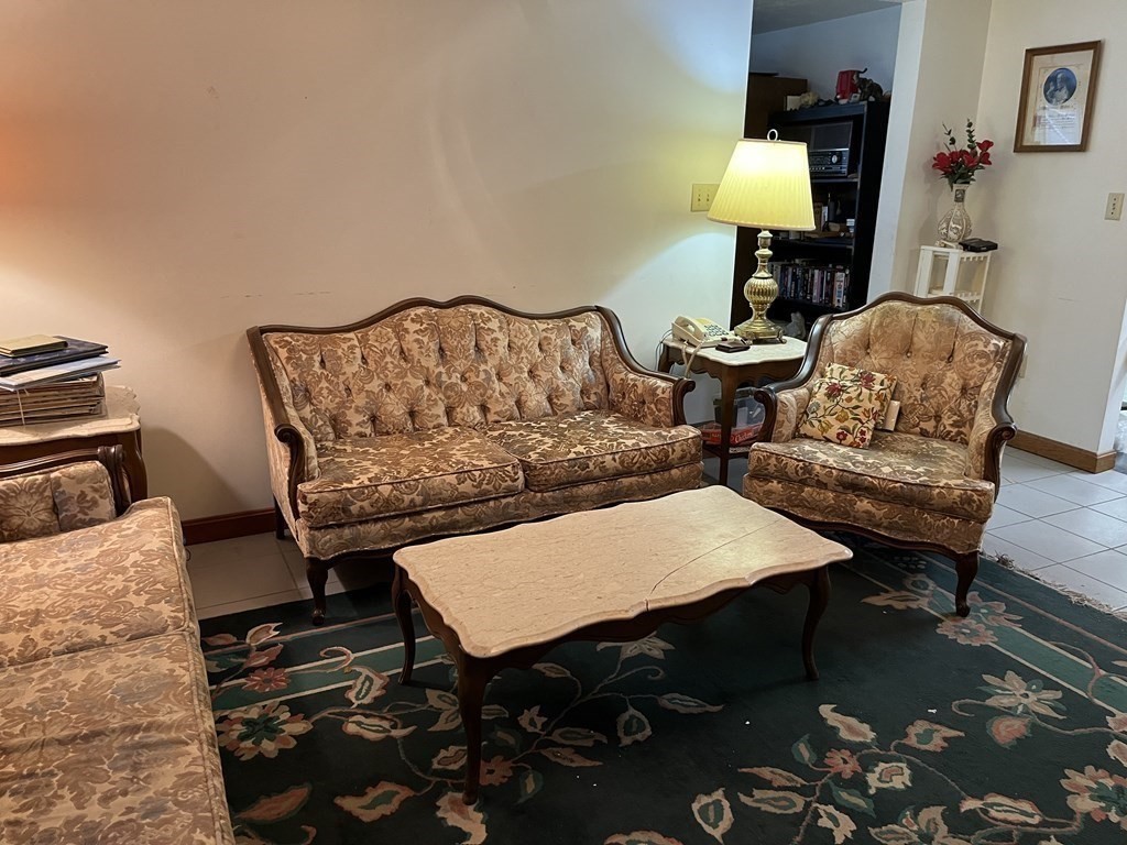 23 Crooked River Road Wareham, MA 02571 - Photo 2 of 11 a living room with furniture and a lamp