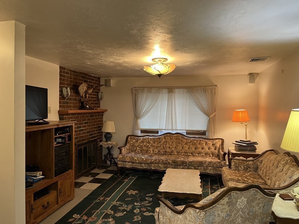 23 Crooked River Road Wareham, MA 02571 - Photo 3 of 11 a bedroom with a bed and wooden floor