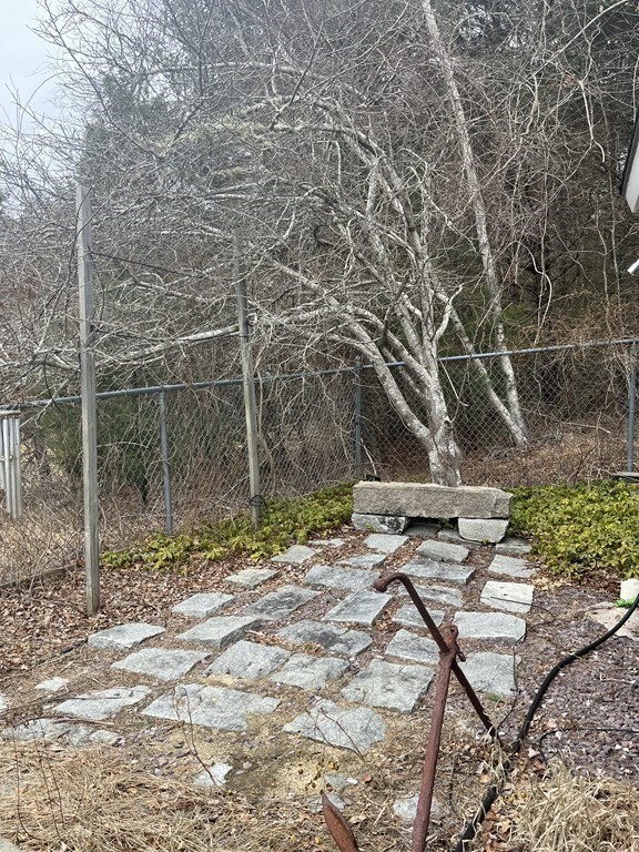 23 Crooked River Road Wareham, MA 02571 - Photo 9 of 11 a backyard of a house with table and chairs