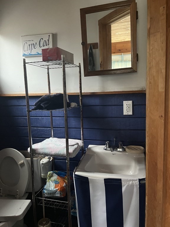 23 Crooked River Road Wareham, MA 02571 - Photo 10 of 11 a bathroom with a sink and a mirror