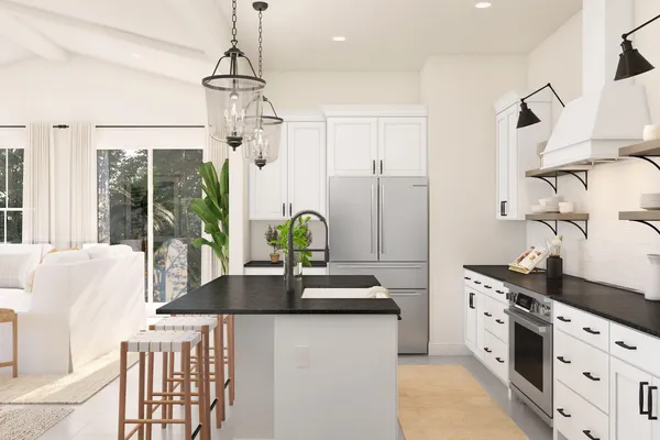 a kitchen with stainless steel appliances granite countertop a sink a stove and a refrigerator