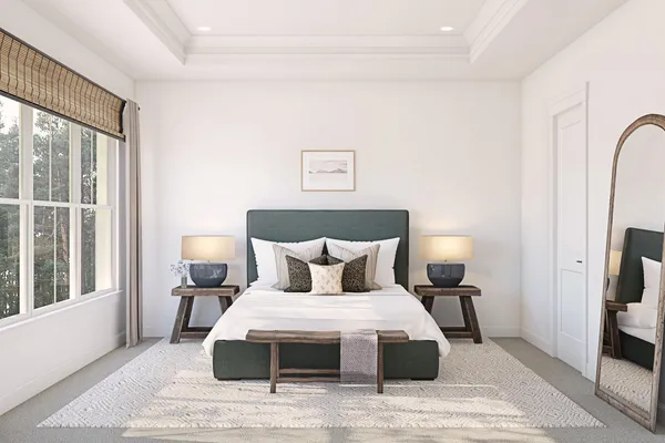 a bedroom with a bed and a large window