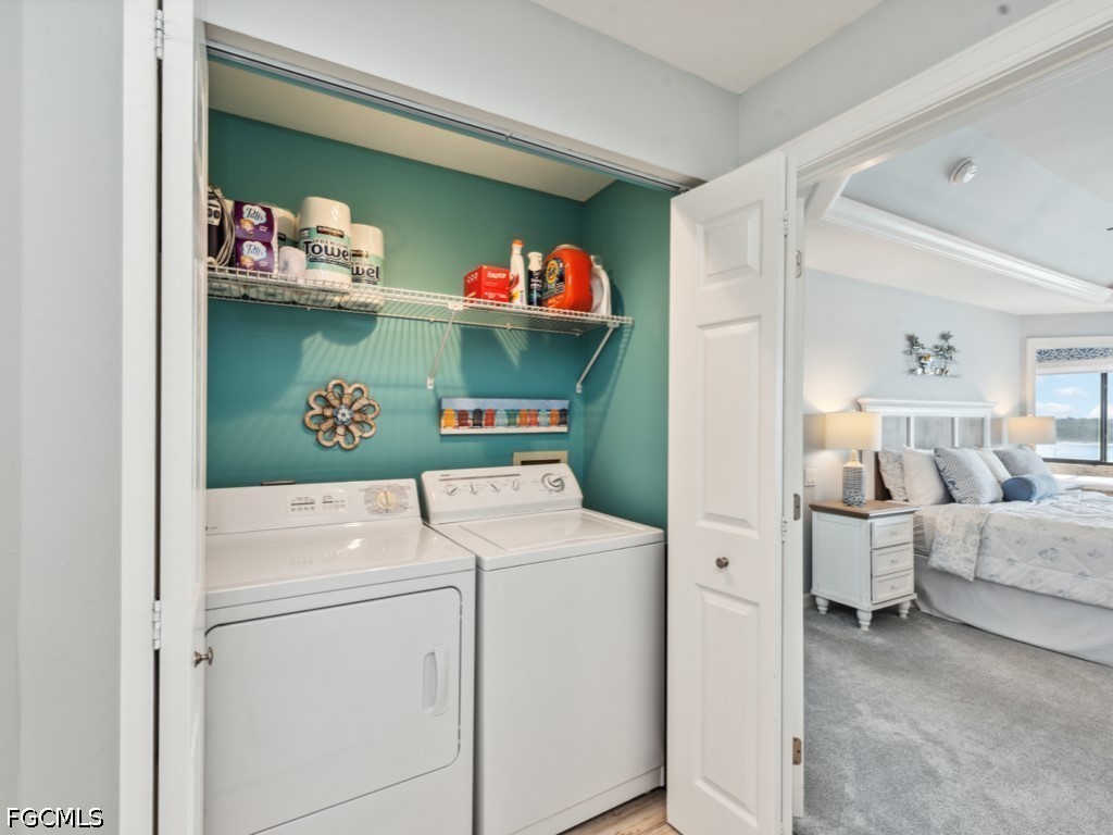 232 La Peninsula Boulevard, Unit 232 Naples, FL 34113 - Photo 23 of 44 a utility room with dryer and washer