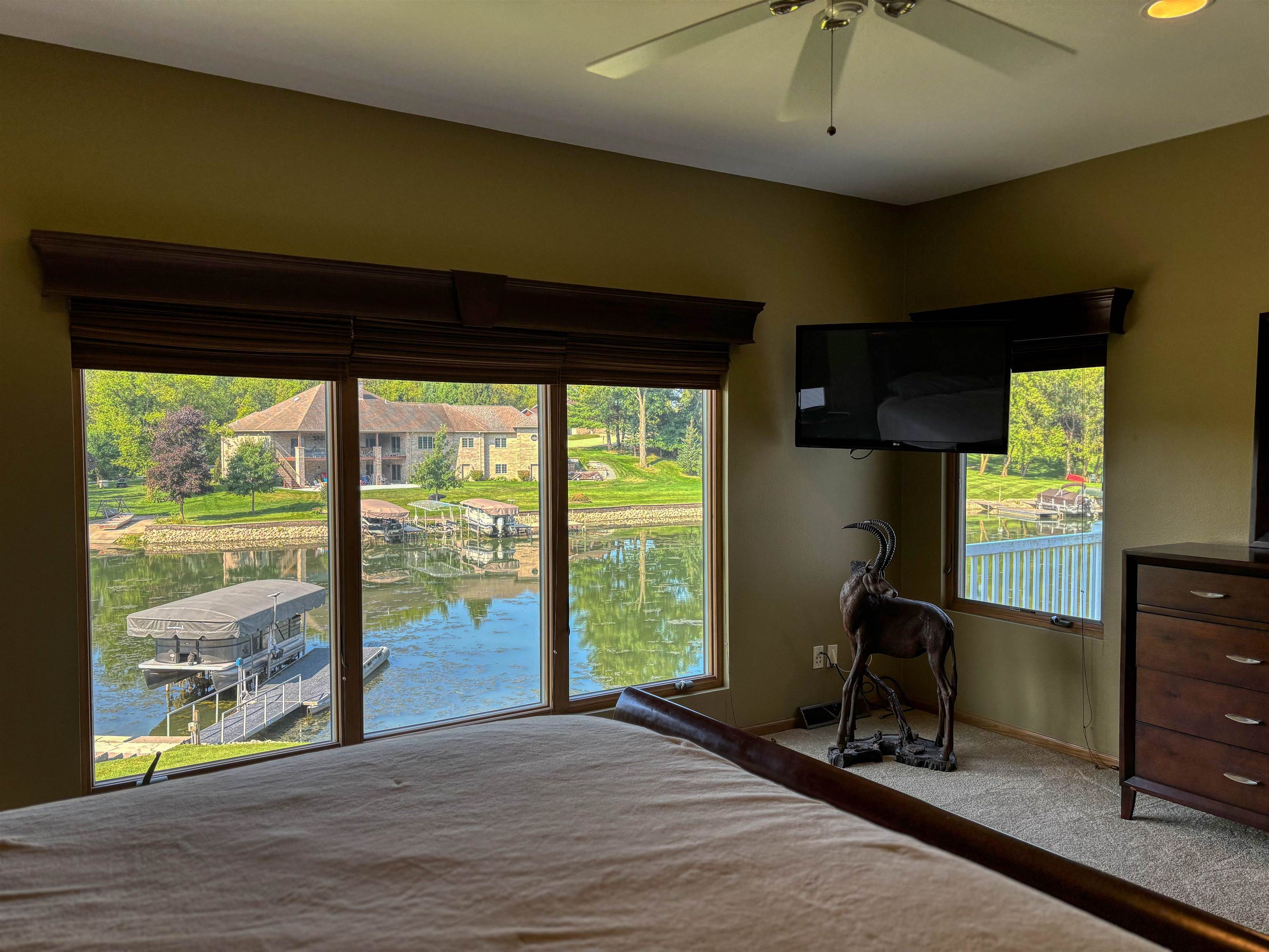 22781 Zier Road Lake Carroll, IL 61046 - Photo 20 of 58 a view of a room with a large window and wooden floor