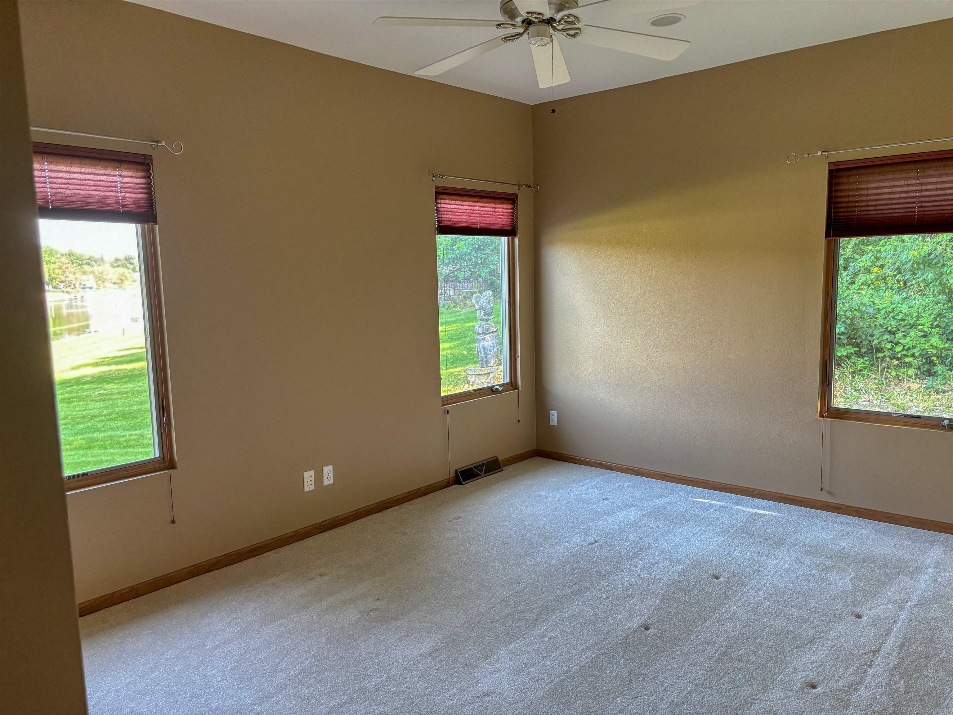 22781 Zier Road Lake Carroll, IL 61046 - Photo 27 of 58 an empty room with windows and fan