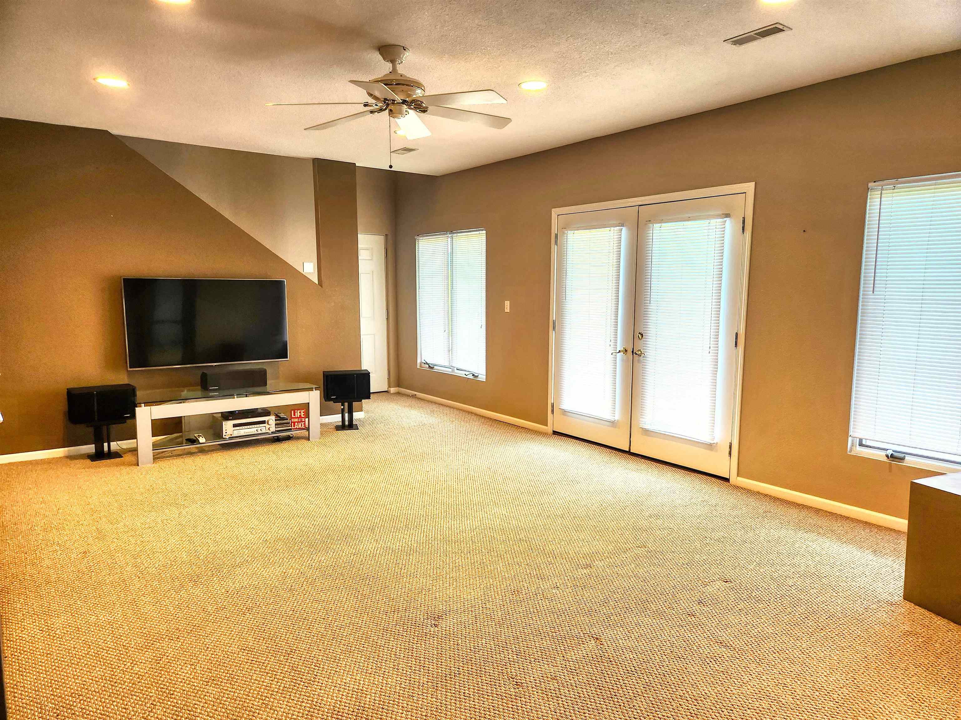 22781 Zier Road Lake Carroll, IL 61046 - Photo 32 of 58 a view of a livingroom with furniture and a flat screen tv