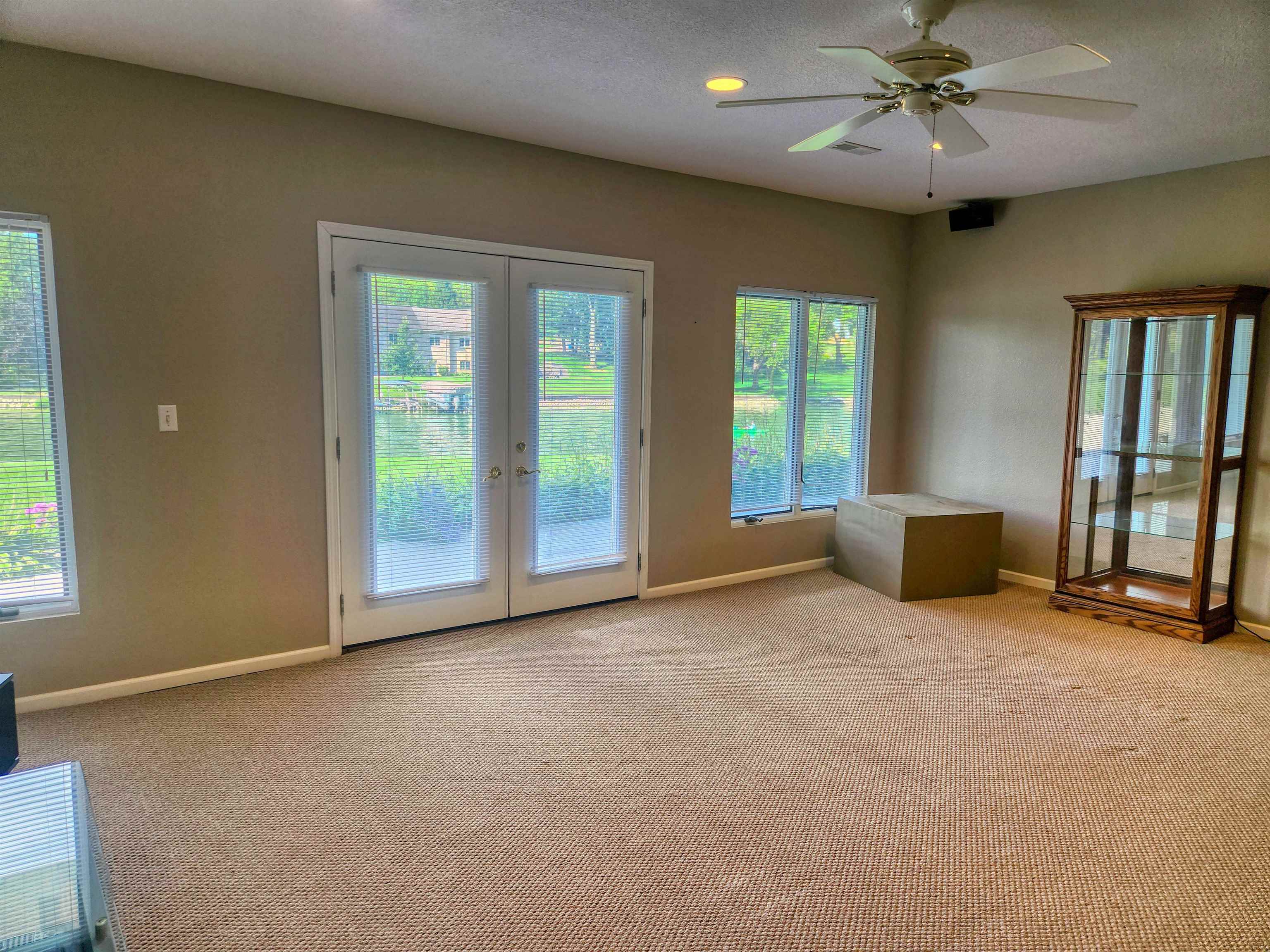 22781 Zier Road Lake Carroll, IL 61046 - Photo 33 of 58 an empty room with windows and fan