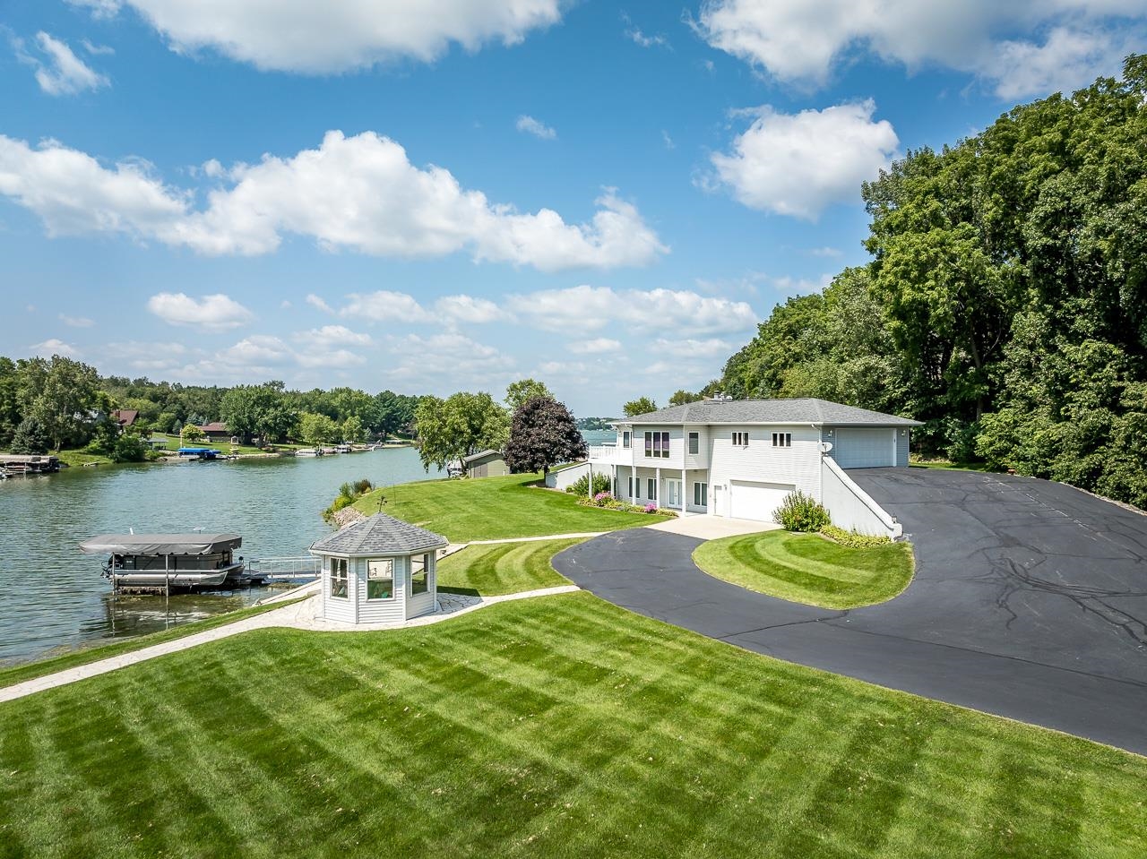 22781 Zier Road Lake Carroll, IL 61046 - Photo 52 of 58 a view of a lake with a yard