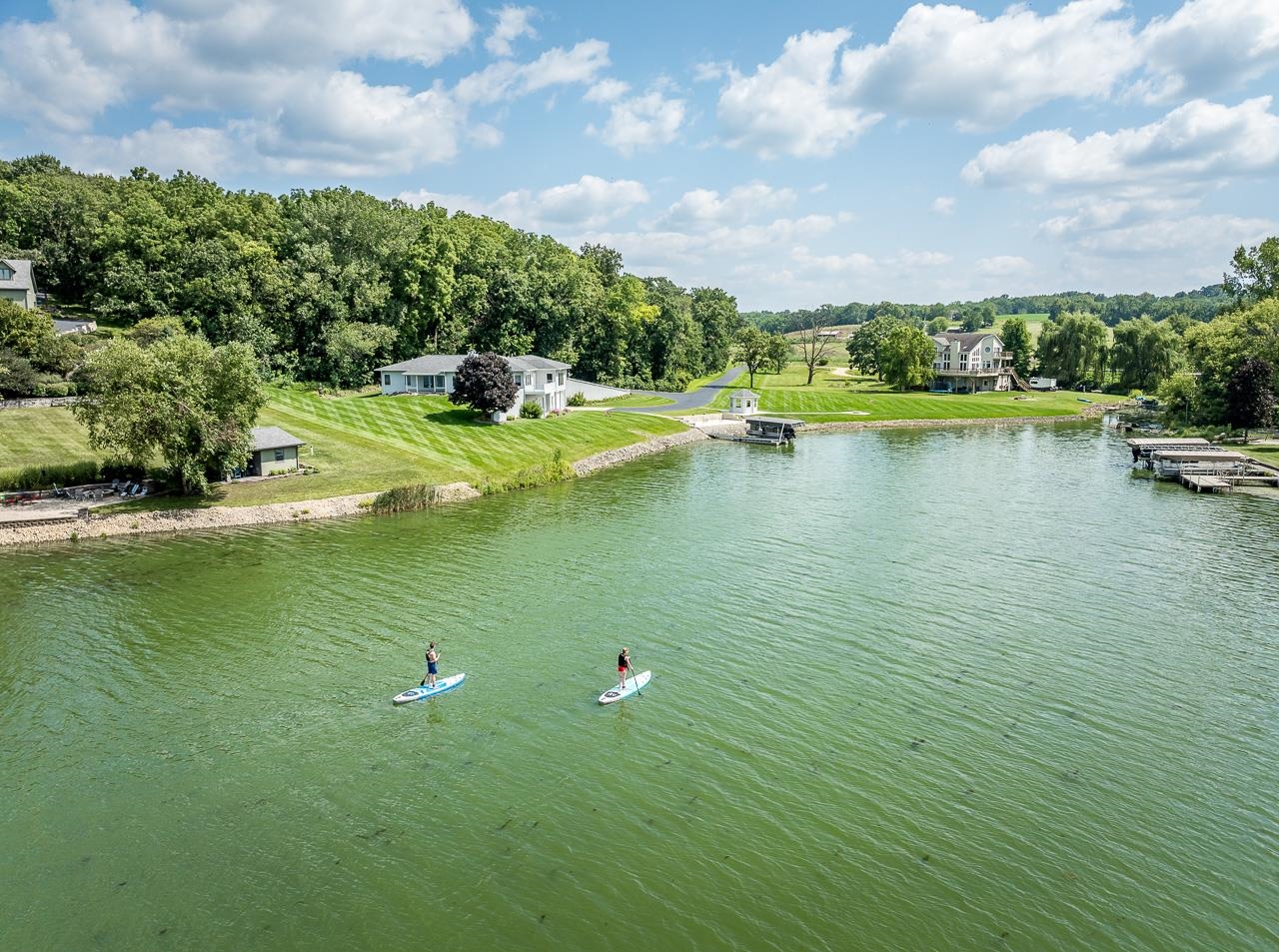 22781 Zier Road Lake Carroll, IL 61046 - Photo 58 of 58 a view of a lake with a house in the background