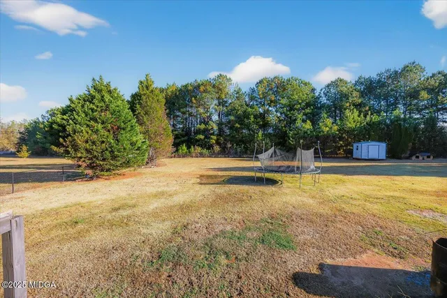 a view of a swimming pool with an outdoor space and seating area