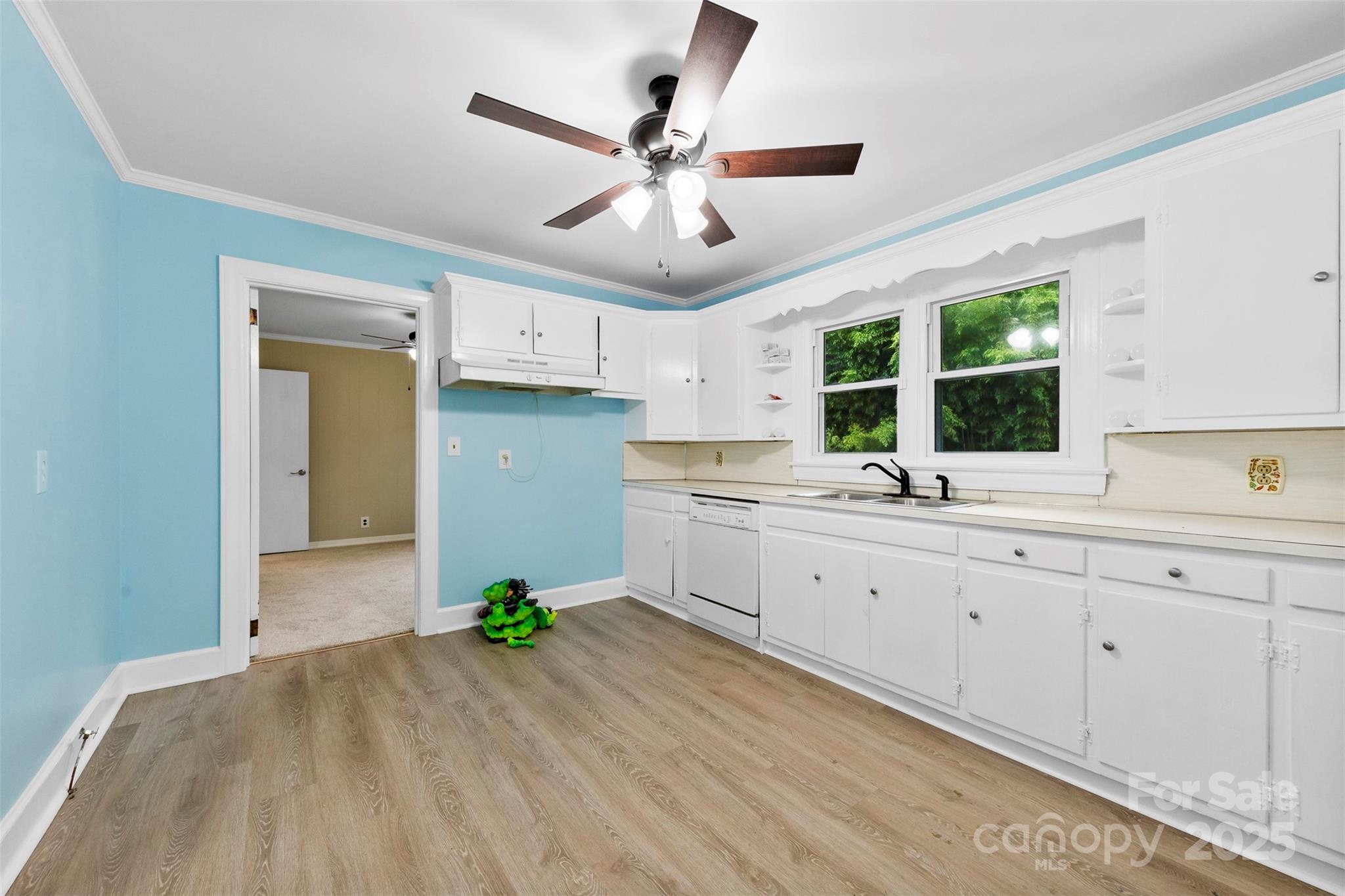 2300 Linwood Road Gastonia, NC 28052 - Photo 8 of 23 a large white kitchen with a large window a sink and stainless steel appliances