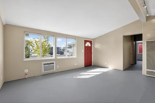a kitchen with stainless steel appliances granite countertop a refrigerator stove and sink