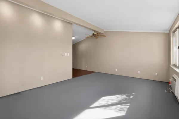 a kitchen with a sink a window and wooden floor