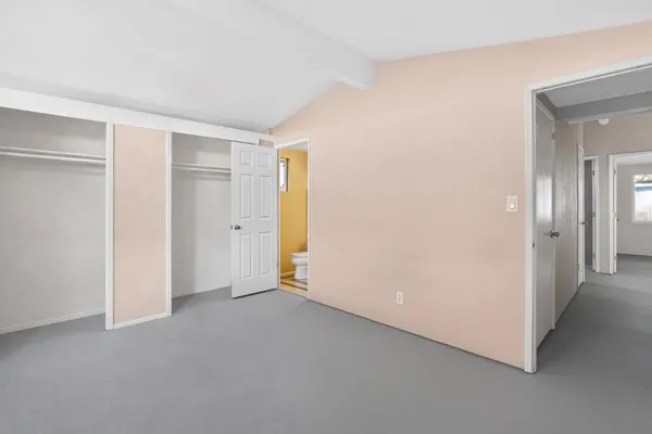 a kitchen with granite countertop a stove top oven microwave and cabinets