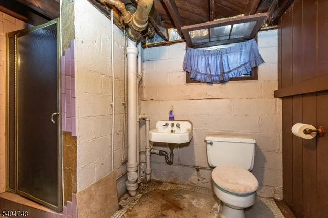 a bathroom with a toilet and a sink