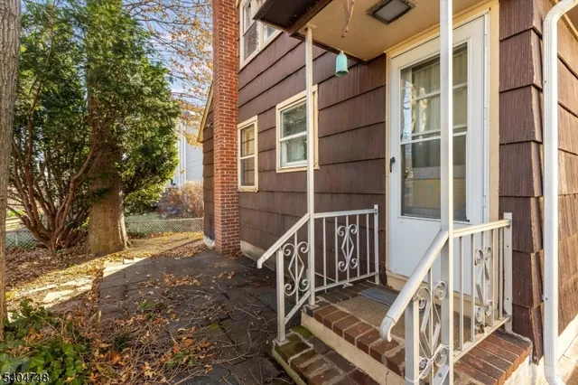 a view of balcony with wooden floor and fence