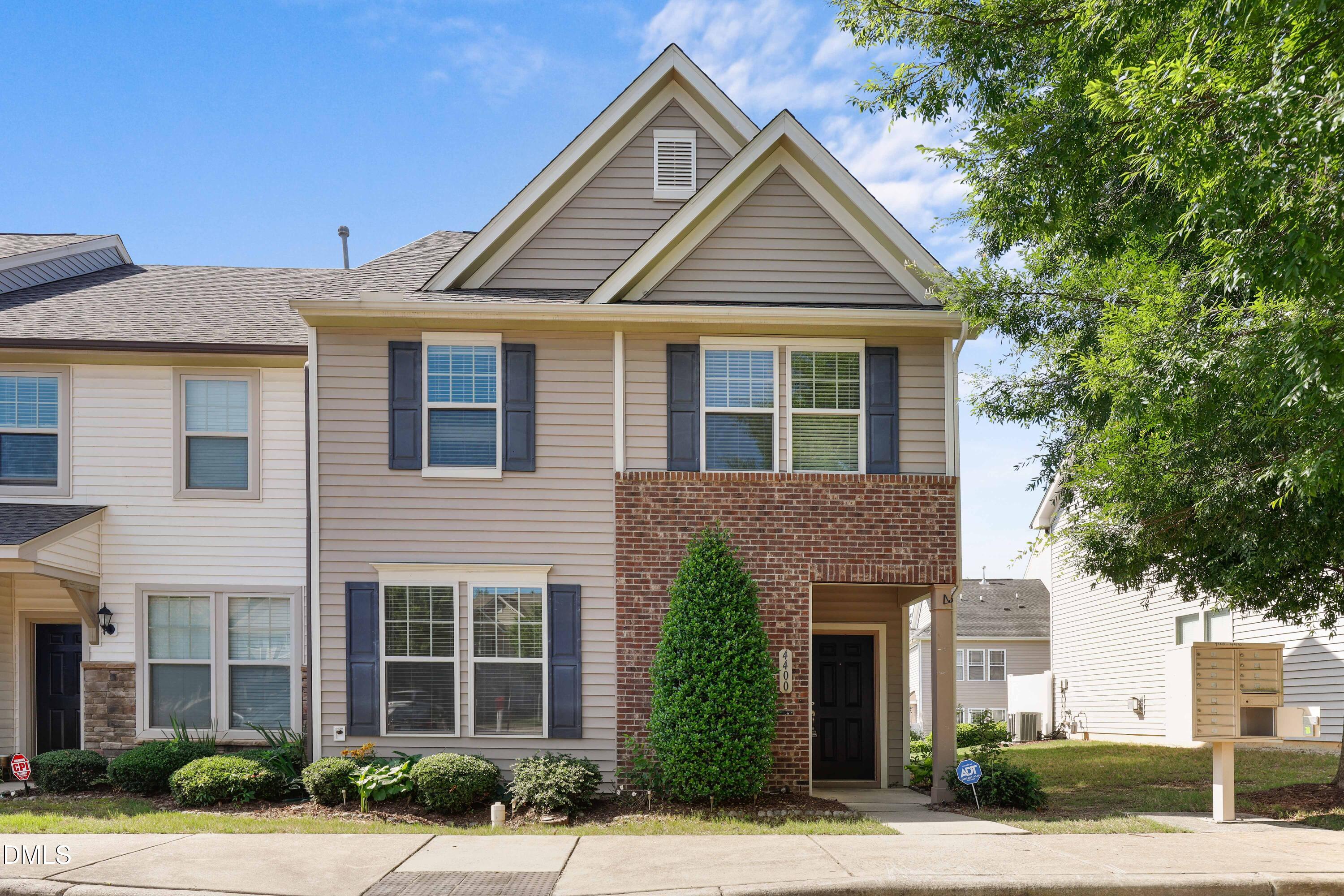 4400 Hillsgrove Road Wake Forest, NC 27587 - Photo 1 of 49 a front view of a house with a yard and garage