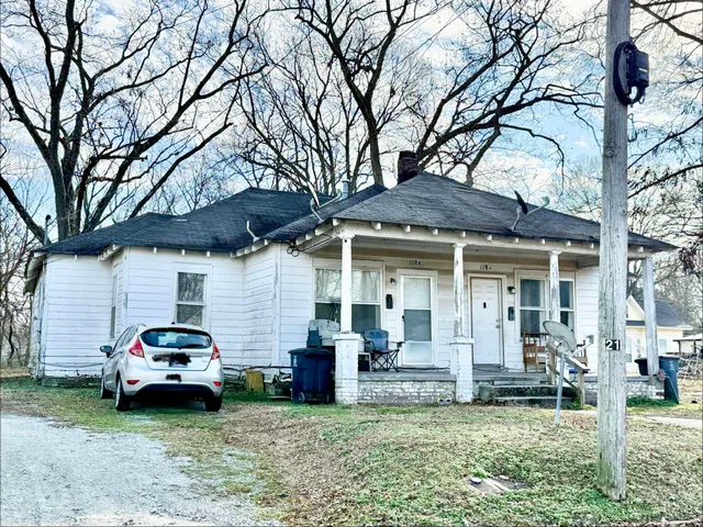 a car parked in front of a house