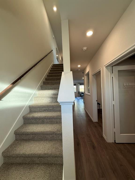 317 Clematis Street Princeton, TX 75407 - Photo 4 of 38 Stairs with wood finished floors and recessed lighting