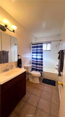 a view of a livingroom with furniture and windows