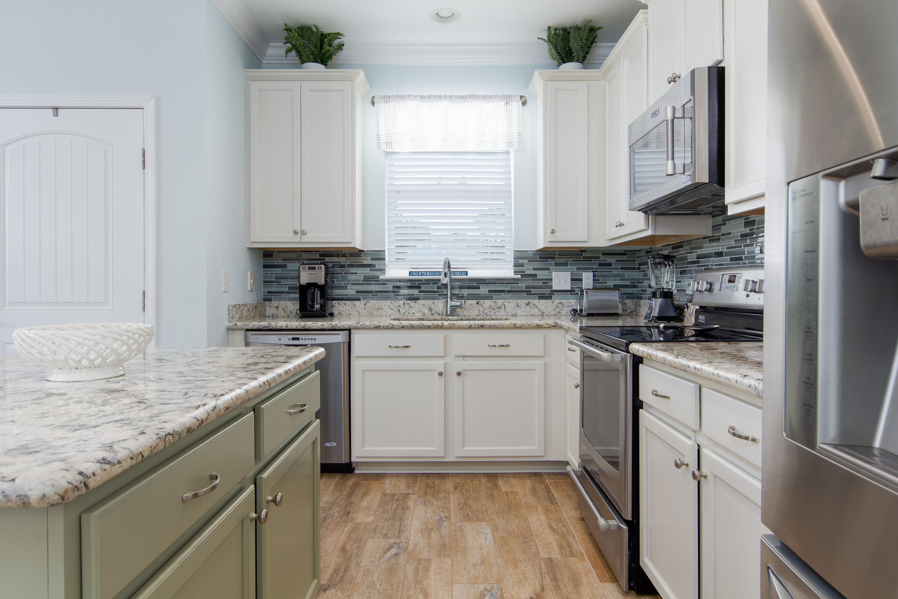 164 Sandpine Loop Inlet Beach, FL 32461 - Photo 8 of 24 a kitchen with granite countertop cabinets stainless steel appliances a sink and a window