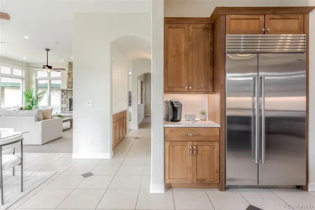 a kitchen with a refrigerator and a sink
