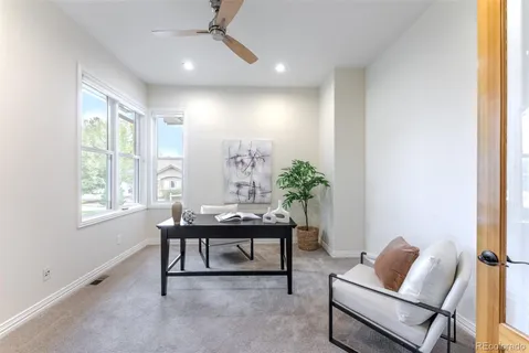 a view of a livingroom with furniture and window
