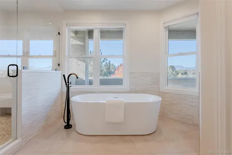 a white bath tub sitting in a bathroom