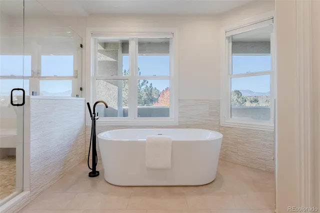 a white bath tub sitting in a bathroom