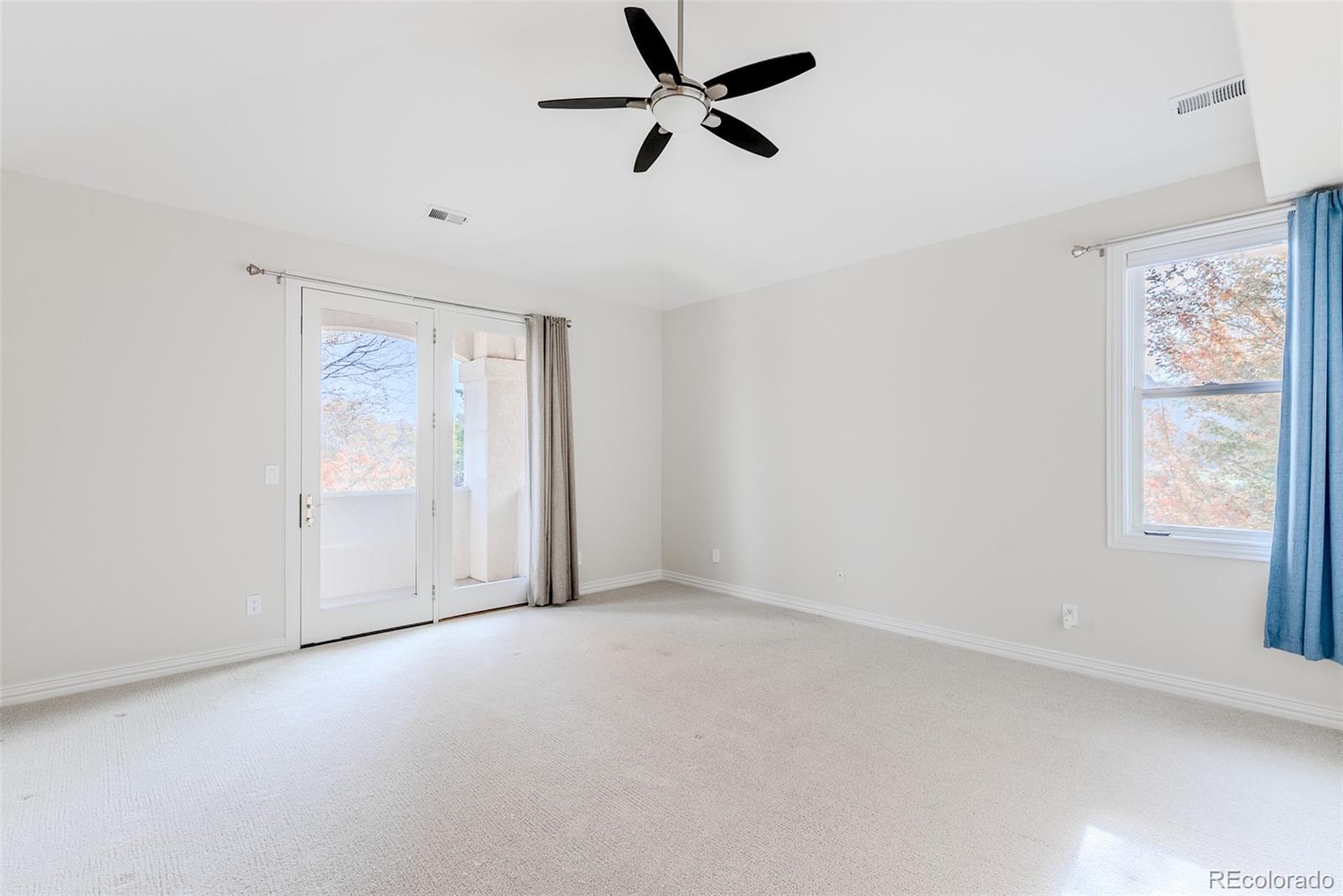 768 Bridger Point Lafayette, CO 80026 - Photo 28 of 50 an empty room with windows and fan