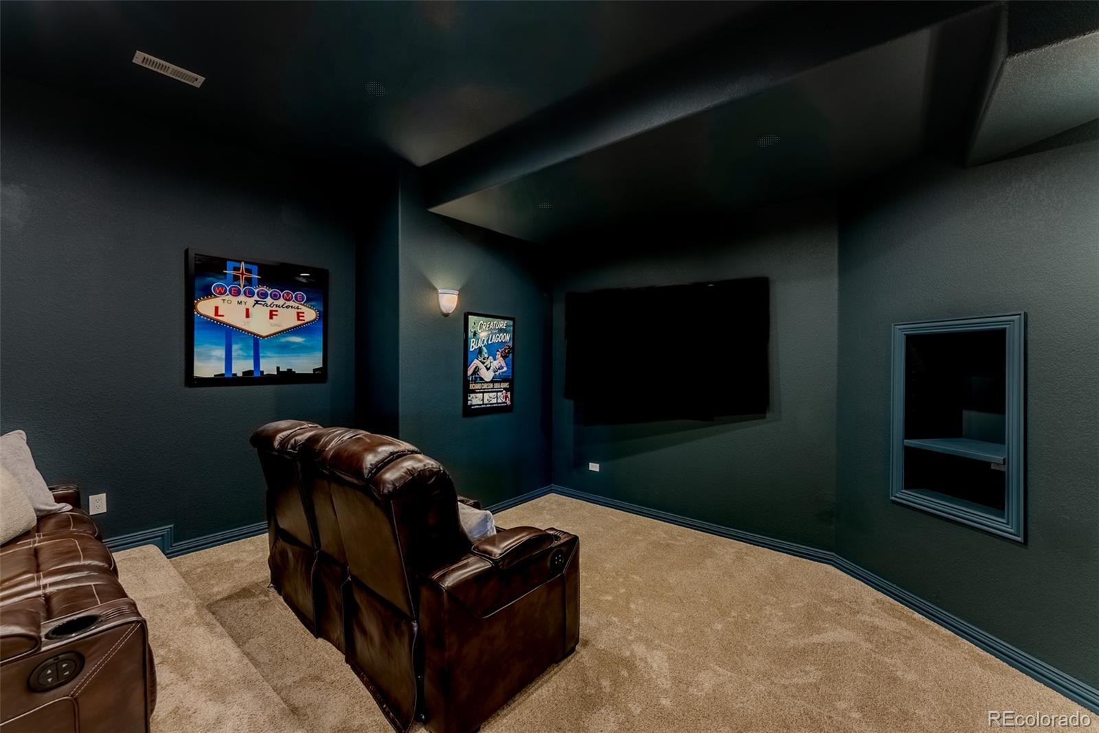 768 Bridger Point Lafayette, CO 80026 - Photo 36 of 50 a living room with furniture and a flat screen tv