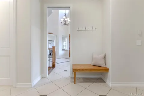 a front view of a house with a yard table and chairs