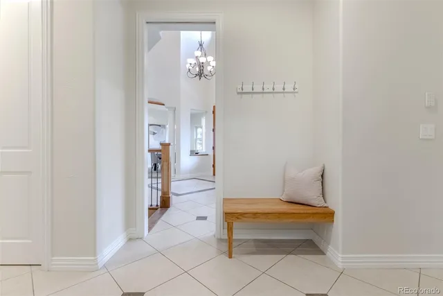 a front view of a house with a yard table and chairs