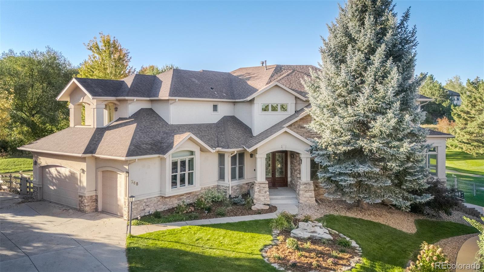 768 Bridger Point Lafayette, CO 80026 - Photo 4 of 50 a aerial view of a house with a yard