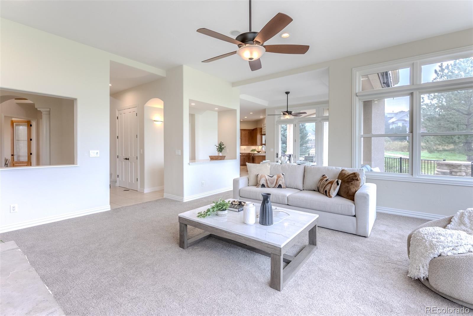768 Bridger Point Lafayette, CO 80026 - Photo 8 of 50 a living room with furniture and a large window