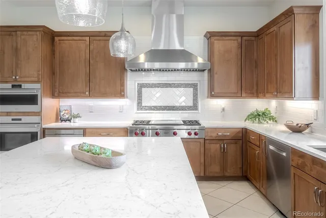 a kitchen with a sink a stove and cabinets