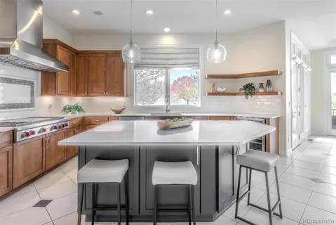 a kitchen with a table chairs stove and cabinets