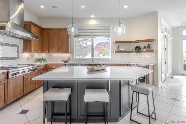 a kitchen with a table chairs stove and cabinets