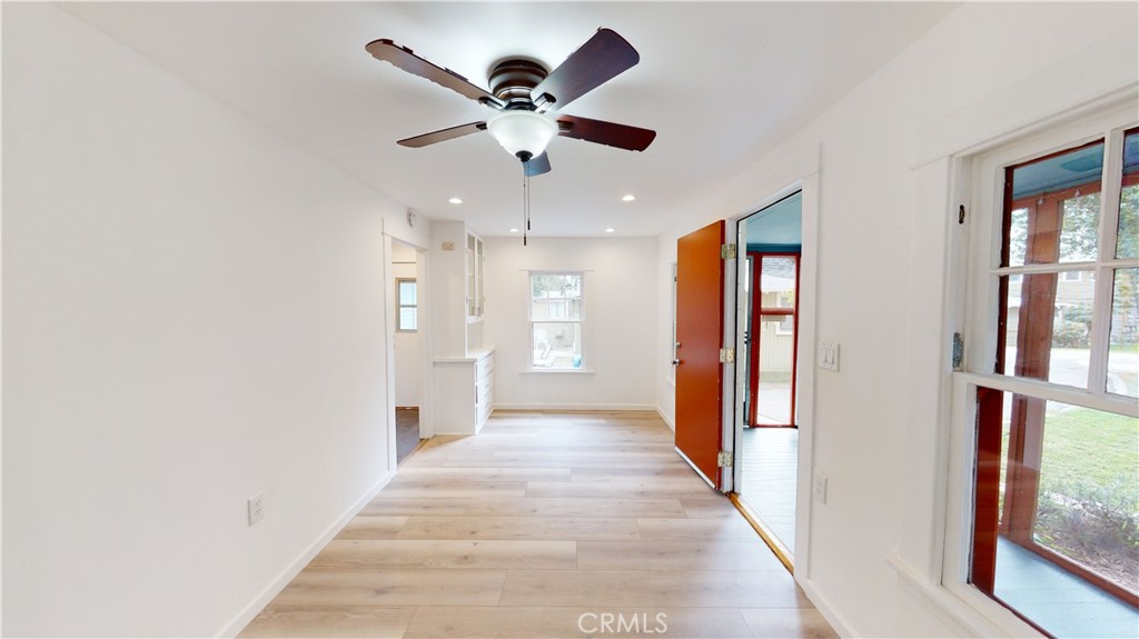 542 North Madison Avenue Pasadena, CA 91101 - Photo 18 of 27 a view of a hallway with a chandelier fan and windows