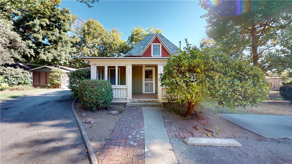 542 North Madison Avenue Pasadena, CA 91101 - Photo 7 of 27 a view of a house with brick walls and a yard