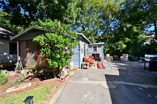 a view of house with outdoor seating