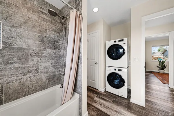 a view of a hallway with washer and dryer