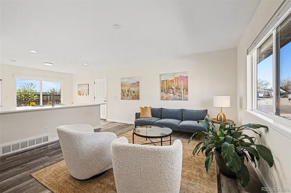a living room with furniture and a large window