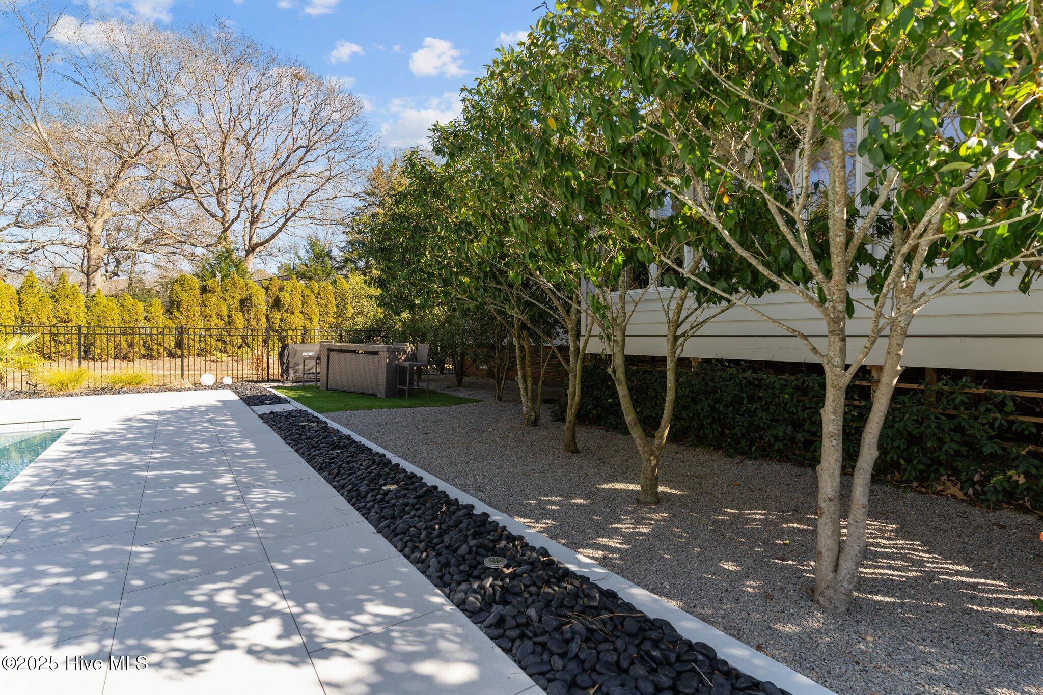 605 Ravenswood Road Hampstead, NC 28443 - Photo 16 of 55 Imported black beach stones