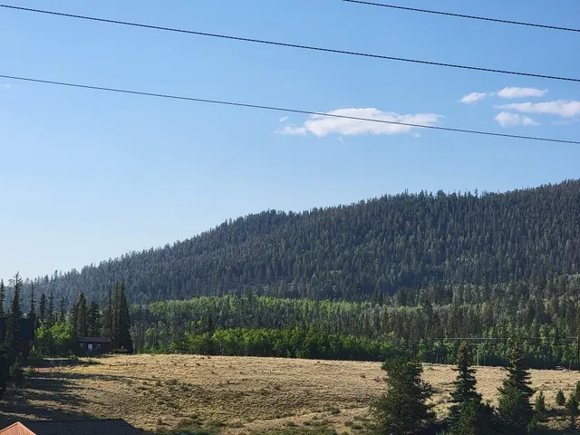 a view of mountains and sunset