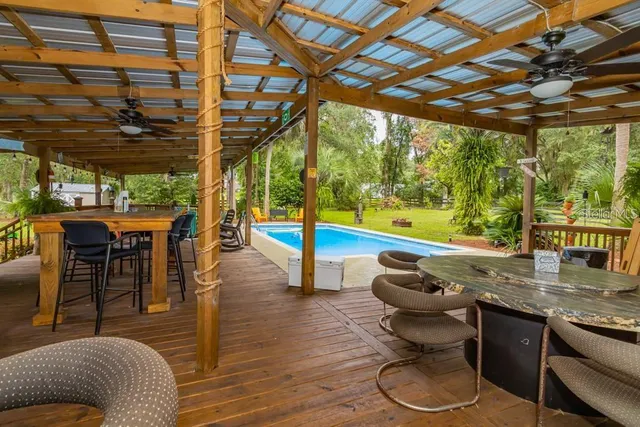 a living room with a table and chairs