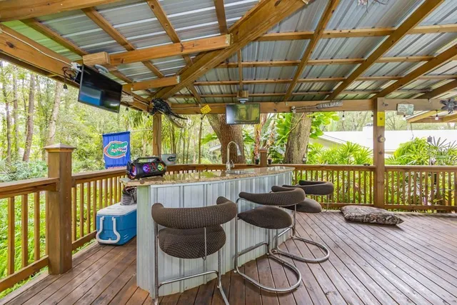 a balcony with furniture and wooden floor