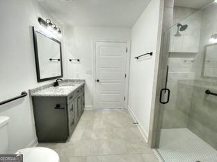1333 Mooty Bridge Road, Unit 2 LaGrange, GA 30240 - Photo 6 of 17 a bathroom with a granite countertop sink toilet and shower
